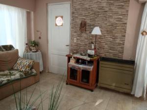 a living room with a couch and a table at Norma in Tandil