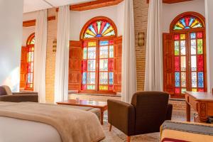 Ένα ή περισσότερα κρεβάτια σε δωμάτιο στο Riad Al Ansari