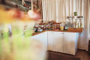 a kitchen with a counter with food on it at Residence il Mandorlo in Lacona