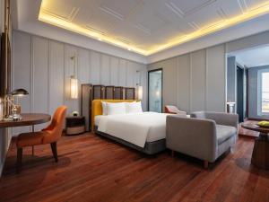 Voodi või voodid majutusasutuse Minerva Premium Hotel toas