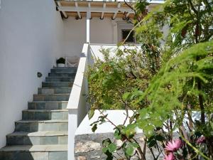 a set of stairs leading up to a house at Blue Sky - Hydra Memories House in Hydra
