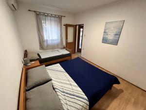 Кровать или кровати в номере Apartments Branko