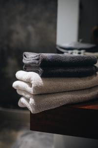 a stack of towels sitting on top of a table at Kaliwa Lodge in Moshi