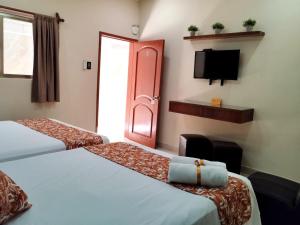 Katil atau katil-katil dalam bilik di Hotel San Miguel