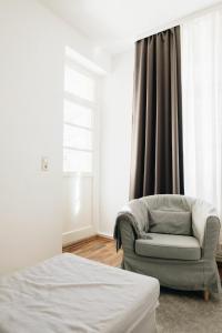 En eller flere senge i et værelse på Große zwei Zimmer Wohnung mit Balkon