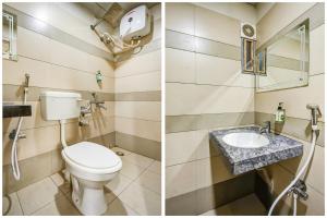 a bathroom with a toilet and a sink at Super Collection O 75732 Hotel Aatithya in Bhubaneshwar