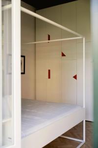 a room with a white bunk bed with red squares at Posillipo 70 Napoli in Naples
