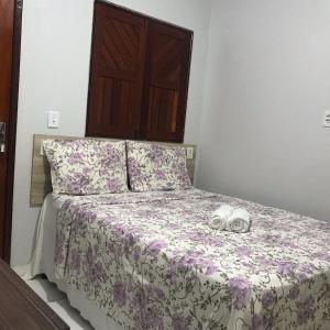 Giường trong phòng chung tại Mandacaru pousada