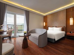 Voodi või voodid majutusasutuse Minerva Premium Hotel toas