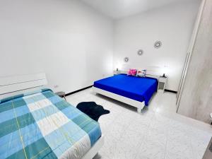 Postel nebo postele na pokoji v ubytování AMBRA’S HOME