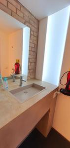 a bathroom with a sink and a mirror at Helles Zimmer im Loft in Mannheim