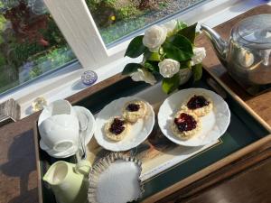 two plates of food on a tray on a table at The Old Manse in Lowick