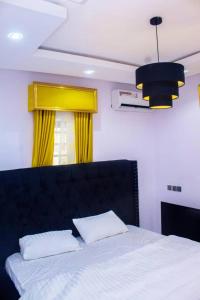 Postel nebo postele na pokoji v ubytování A and T apartment