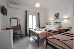 Postel nebo postele na pokoji v ubytování Asteri Hotel