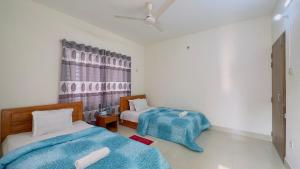 Postelja oz. postelje v sobi nastanitve Hotel Stay Inn Uttara