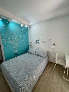 A bed or beds in a room at L'arcobaleno