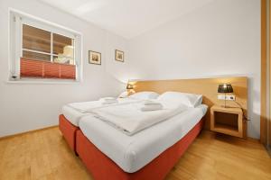 מיטה או מיטות בחדר ב-Apartment Ski & Golf Top 6 by Four Seasons Apartments