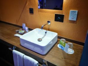a white sink on a counter in a bathroom at MB Boutique Hotel - Adults Recommended in Nerja