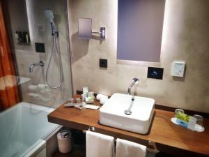 a bathroom with a sink and a shower at MB Boutique Hotel - Adults Recommended in Nerja