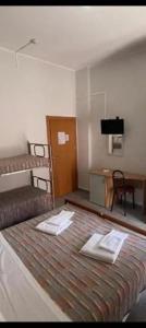 Un ou plusieurs lits dans un hébergement de l'établissement HOTEL PICCARI Nuova gestione