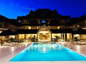 a pool at a resort at night at Ocean zuri villa in Watamu +31 photos
