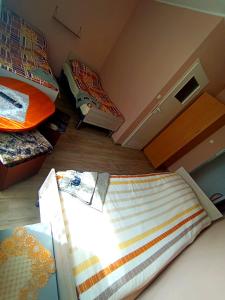 a small room with two beds in a room at Zajazd Mieszko in Opole