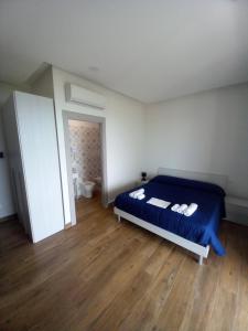 Posteľ alebo postele v izbe v ubytovaní Qvattro stagioni panoramic suites