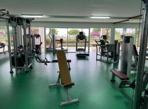 a gym with several tread machines in a room at la perle du nord by marina golf asilah in Asilah