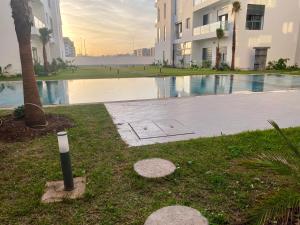 a swimming pool in the middle of a building at Glorious NOUACEUR in Nouaceur