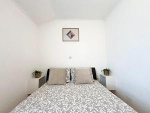 Łóżko lub łóżka w pokoju w obiekcie Apartments Contessa