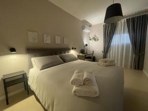 Letto o letti in una camera di Casa Karina