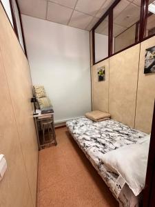 a small room with a bed and a chair at stop & go in Arbós