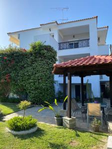 a view of a house with a patio at Fotini's Studios 1 in Toroni