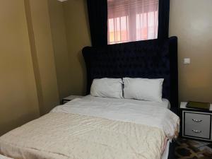 Postel nebo postele na pokoji v ubytování Urban Tranquility