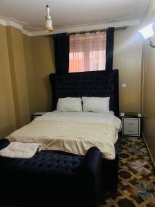 Postel nebo postele na pokoji v ubytování Urban Tranquility