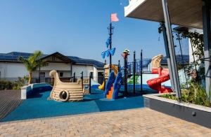 a childrens playground with a slide at Guthulele Living in Ballito