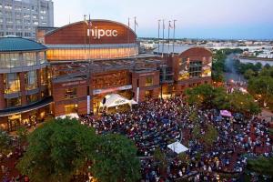 a large crowd of people in front of a building at Home Sweet Home - near NWK & NYC w/free parking in Newark