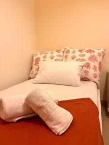 A bed or beds in a room at Marisia Apartment II