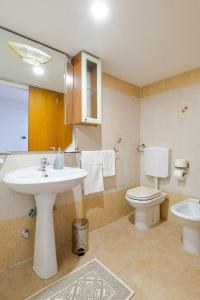 a bathroom with a sink and a toilet at Villa a Serranova, Torre Guaceto in Carovigno +65 photos