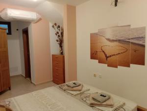 A bed or beds in a room at Pearl Apartments Sozopol