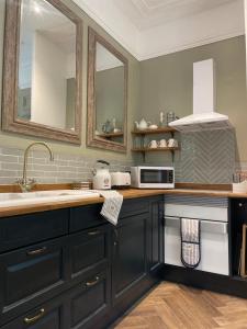 A cozinha ou cozinha compacta de Penarwyn House