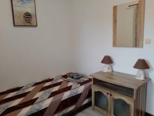 A bed or beds in a room at Pearl Apartments Sozopol