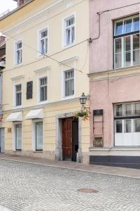 a building with a door on the side of a street at Sofija's Central Apartments in Ljubljana