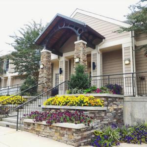 a house with a bunch of flowers in front of it at Avia Residences on Lincoln - Extended Stay in Malvern