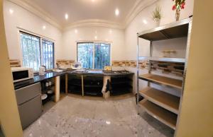 a kitchen with a desk in a room at Mount Pleasant in Brufut