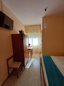 A bed or beds in a room at Alloggio Taddei Még 16 kép