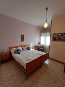 A bed or beds in a room at Alloggio Taddei