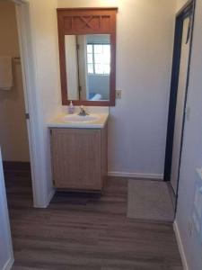 a bathroom with a sink and a mirror at 075B Affordable Retreat nr South Rim Sleeps 2 in Valle