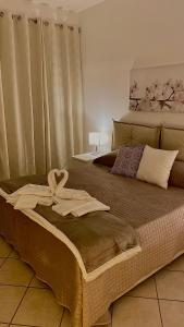 Ένα ή περισσότερα κρεβάτια σε δωμάτιο στο La Dimora