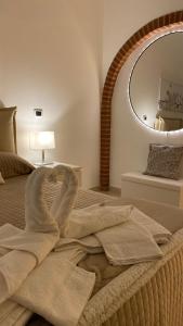 Ένα ή περισσότερα κρεβάτια σε δωμάτιο στο La Dimora